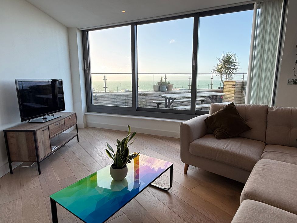 A living room with a television and a coffee table at Apartment 29 in Newquay