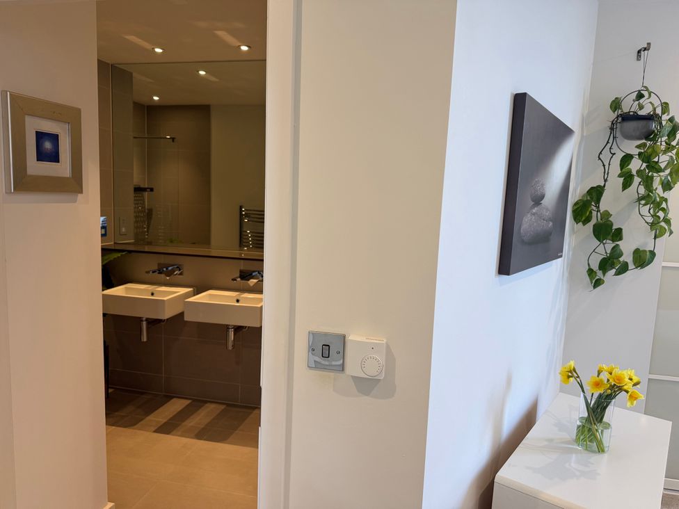 A bathroom with sinks and mirror at Apartment 29 in Newquay