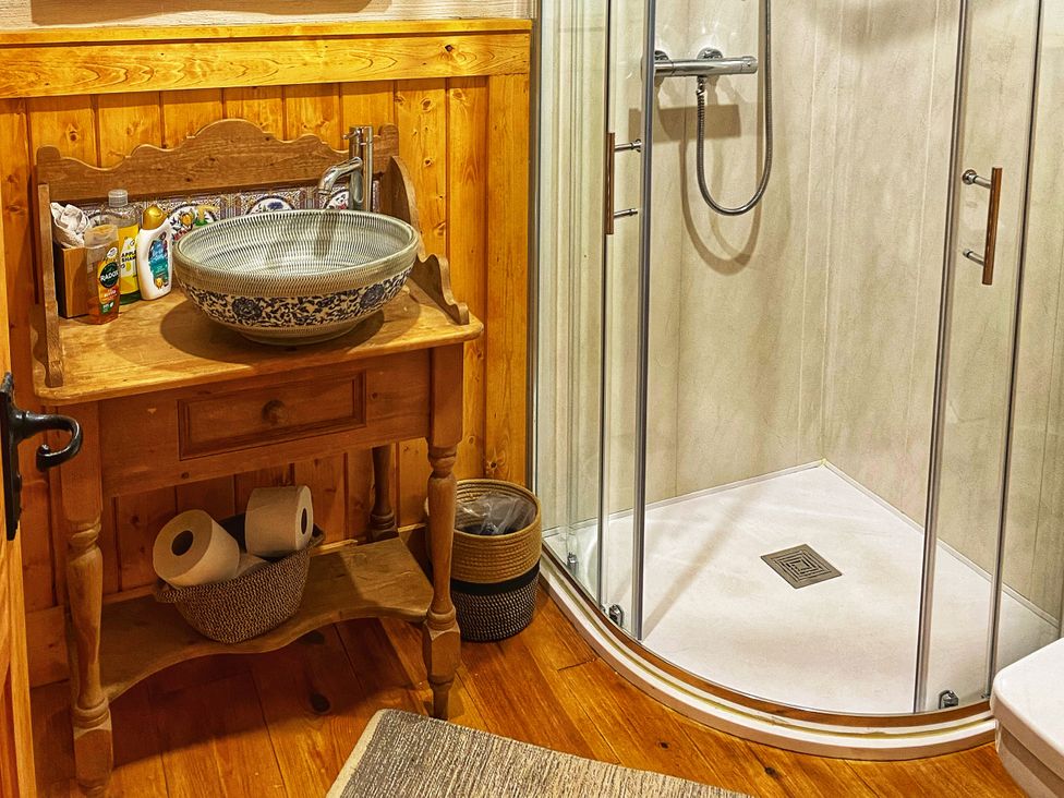 A bathroom with a shower and sink at No 4 Enniskillen