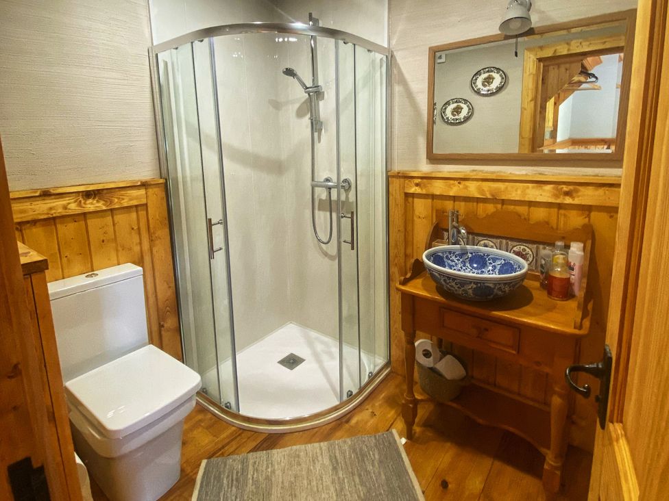 A bathroom with a shower, toilet and sink at No 5 Enniskillen
