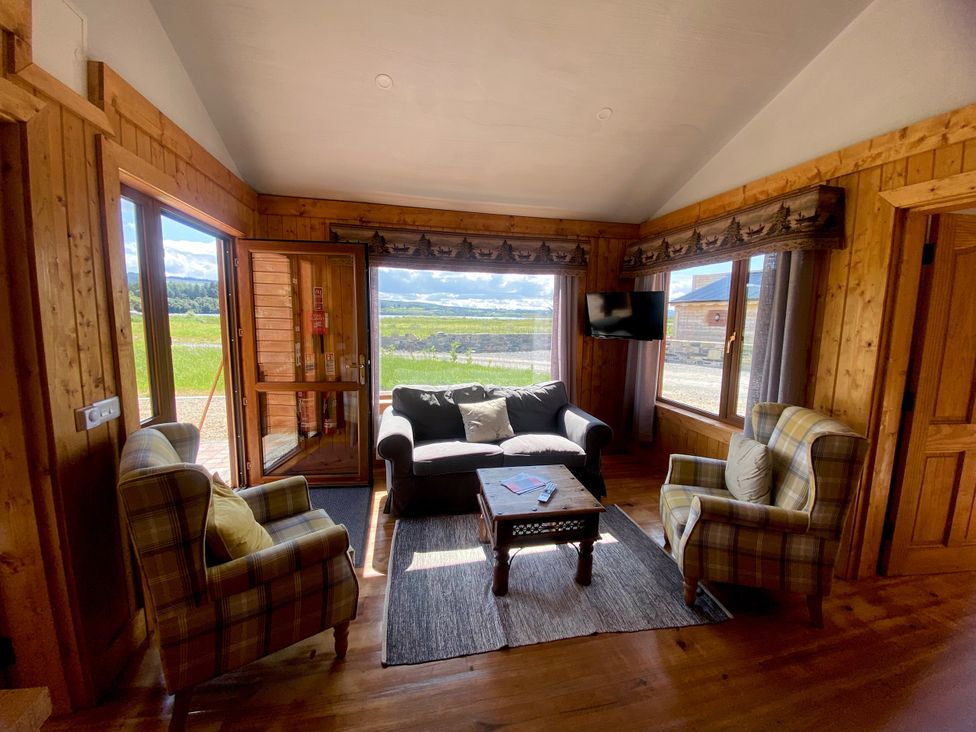 A living room with sofa and chairs at No 6 Enniskillen