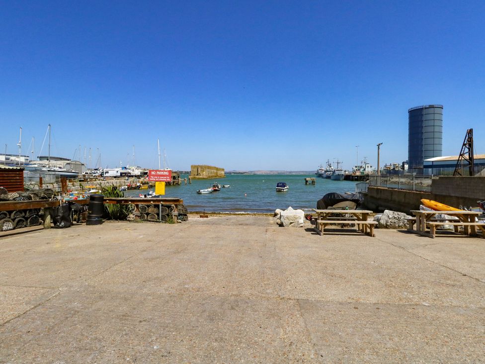 A view of a harbor with boats and a pier at Chandlers Nook in Portland