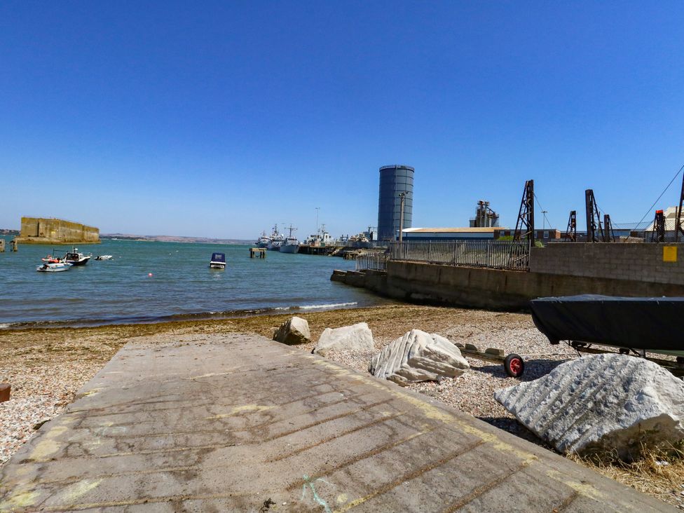 A view of the water with boats and a pier at Chandlers Nook in Portland