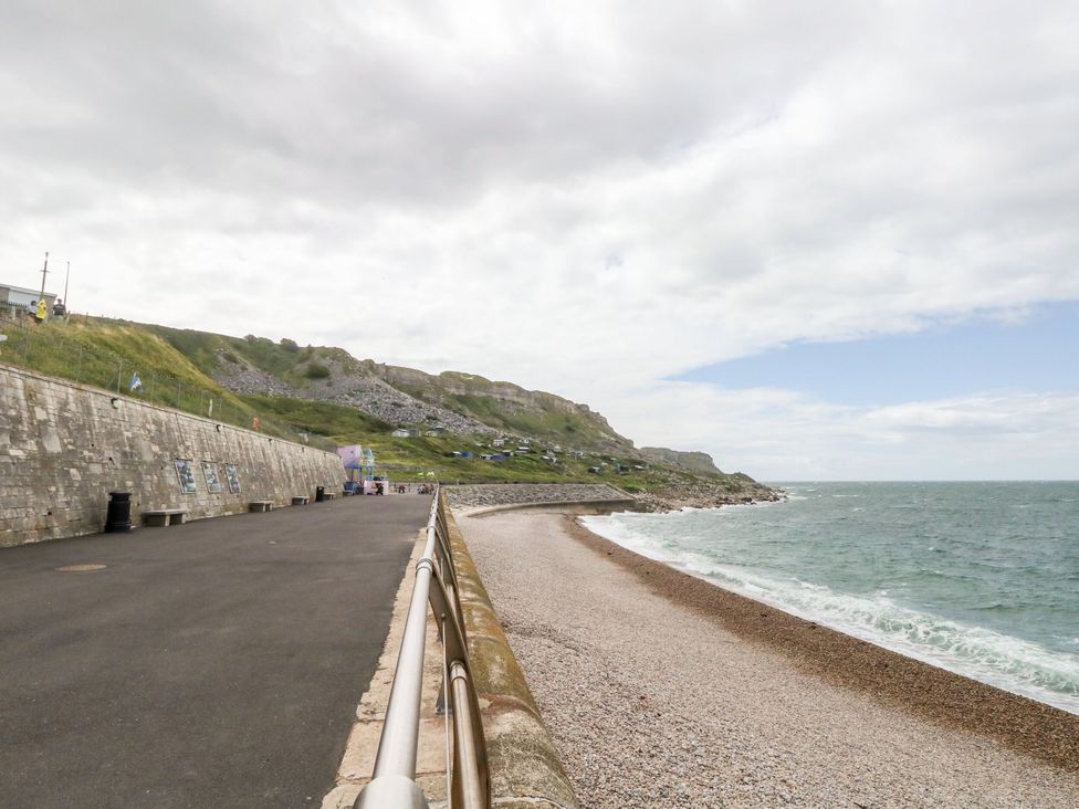 A coastal scene with a path beside the sea at Chandlers Nook in Portland