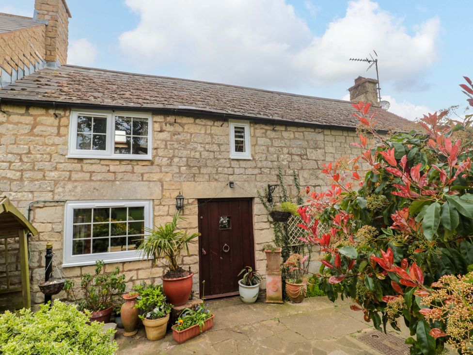 A stone building with a front door and windows at The Annexe at Cherry Cottage Upton St Leonards