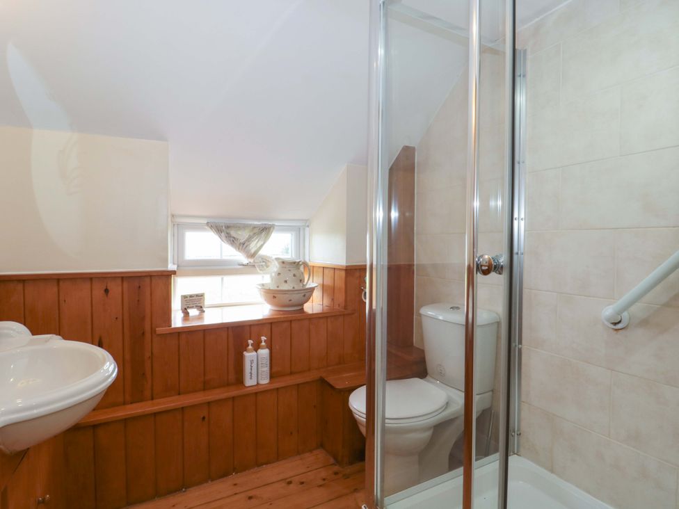 A bathroom with a sink and shower at The Annexe at Cherry Cottage Upton St Leonards