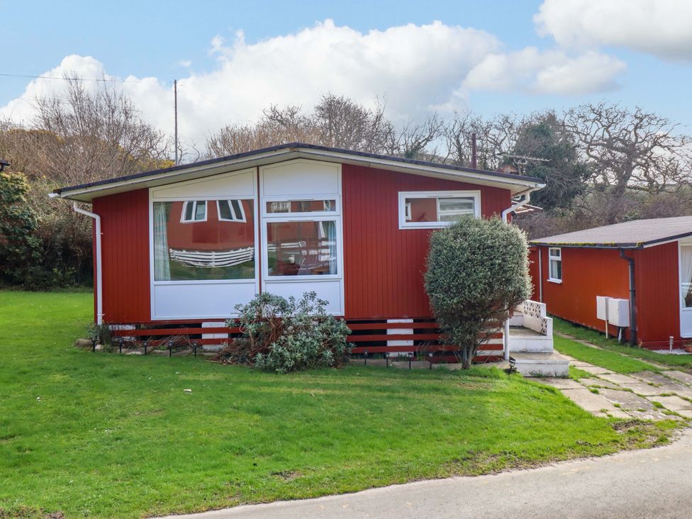 A house with a green garden at Chalet 23 Erw Porthor Tywyn