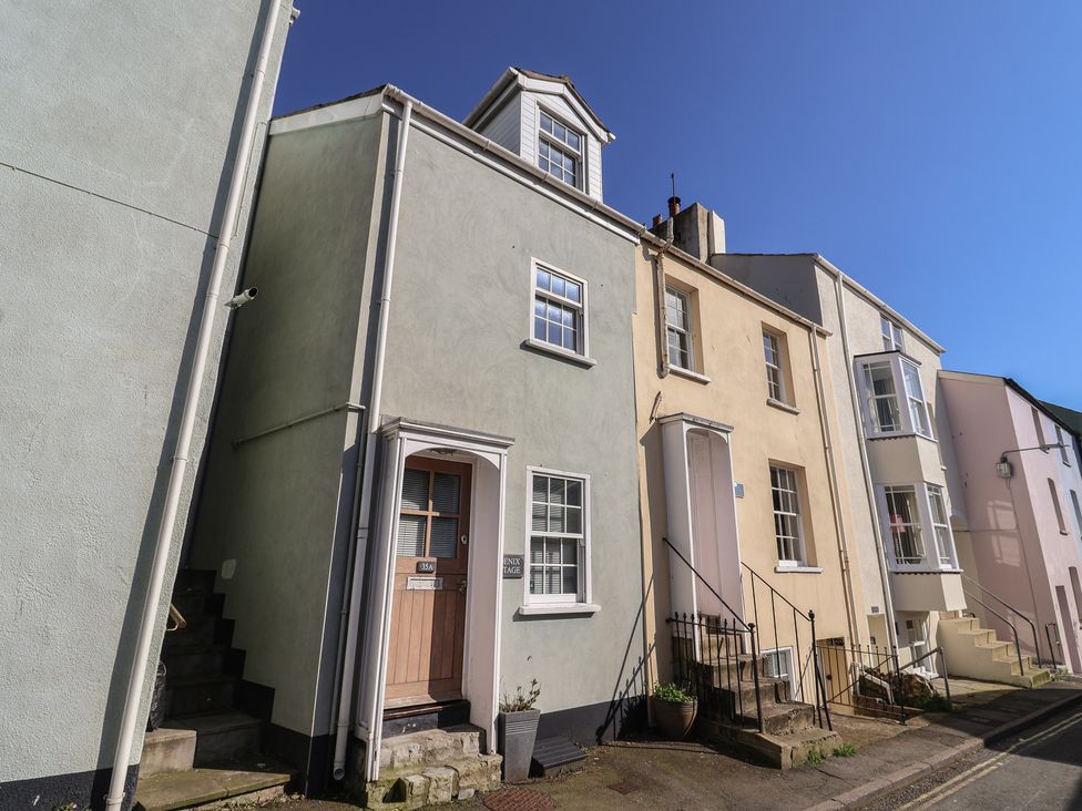 A building with a door and windows at Phoenix Cottage in Lyme Regis
