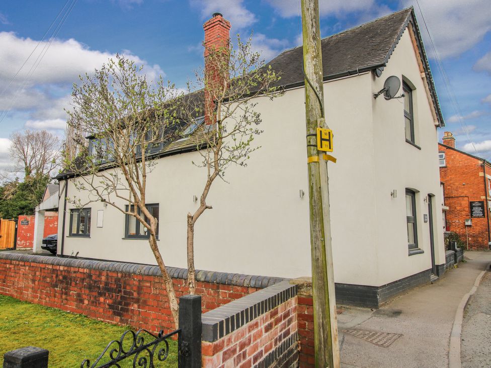 A house with a tree in front at Corner House in Minsterley