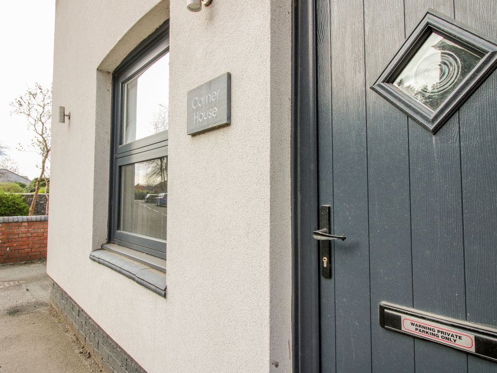 A house exterior with a door and window at Corner House in Minsterley
