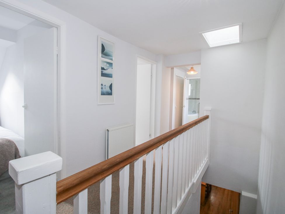 A hallway with doors and a radiator at Corner House in Minsterley