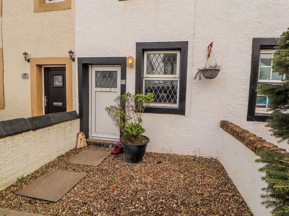 An outdoor entrance with a pathway and plants at 25 Low Seaton Workington