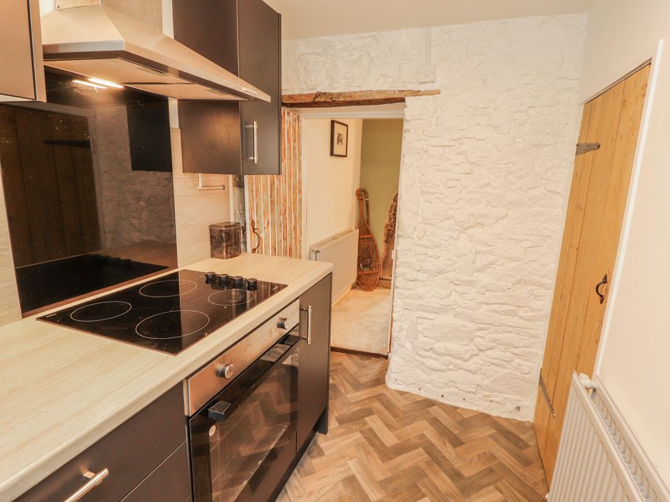 A kitchen with an oven and cooktop at 25 Low Seaton Workington