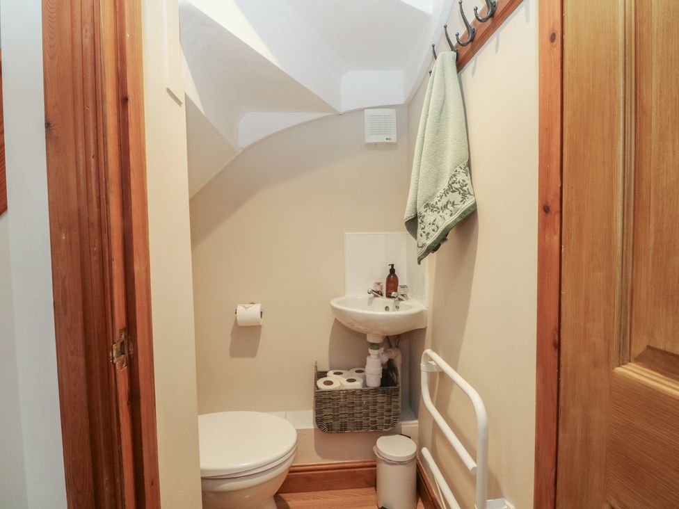 A bathroom with a toilet and sink at 1 The Stables Wrexham
