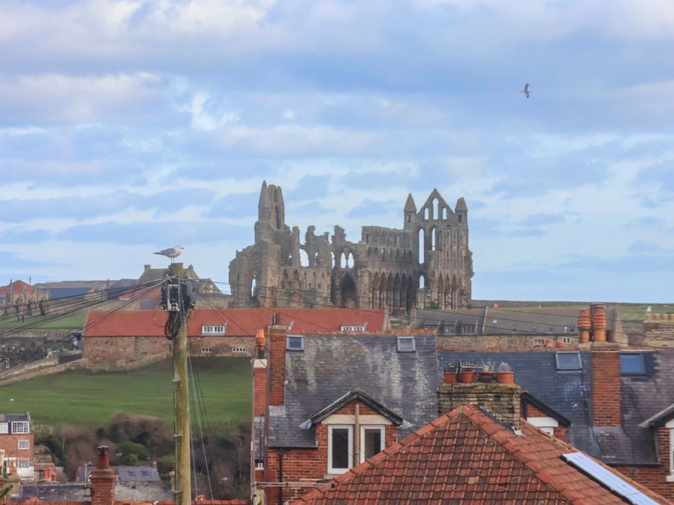 A view of ruins and rooftops at Apartment 12 in 