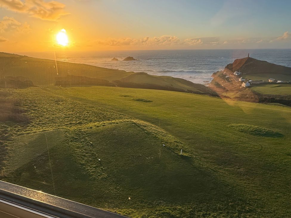 A sunset view over the sea and cliffs at Cape View near St Just
