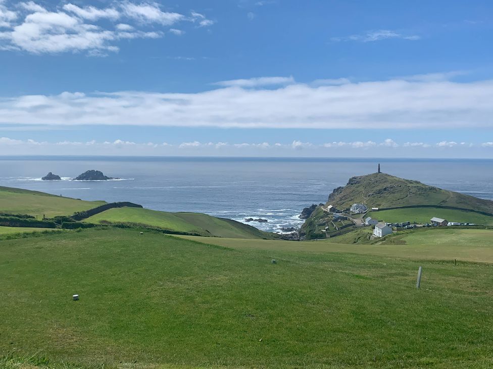 A view of the ocean and lighthouse at Cape View Cape Cornwall near St Just