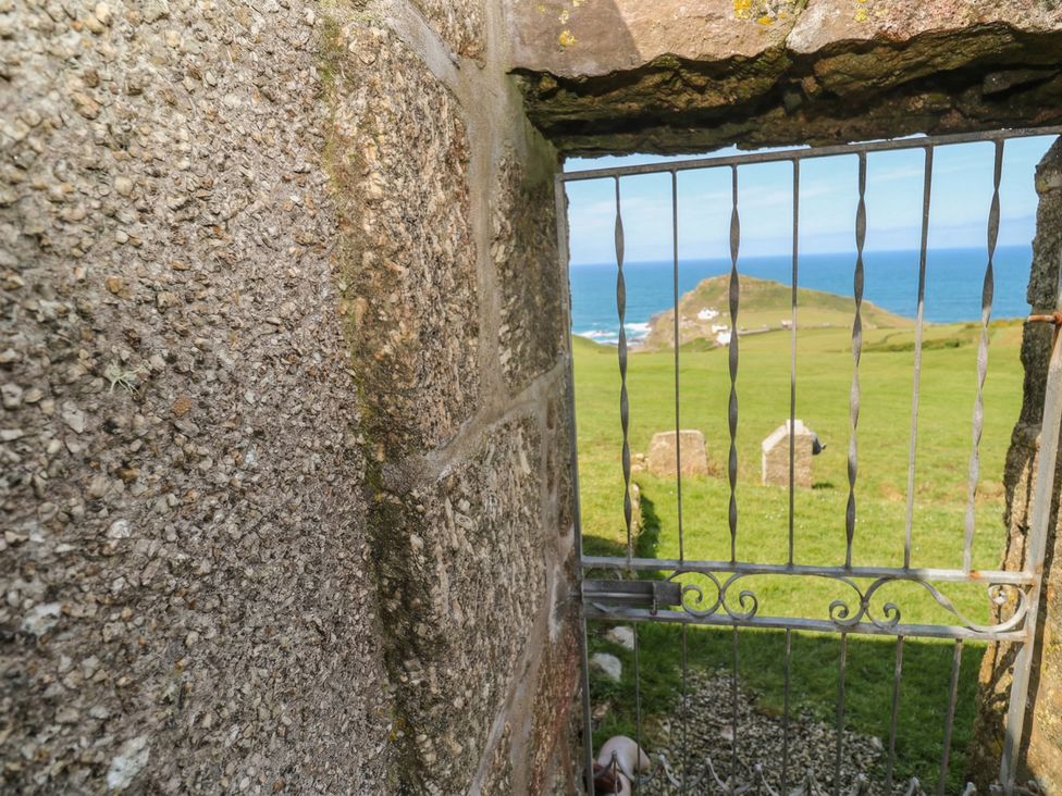 A view through a gate towards the sea at Cape View in Cape Cornwall near St Just