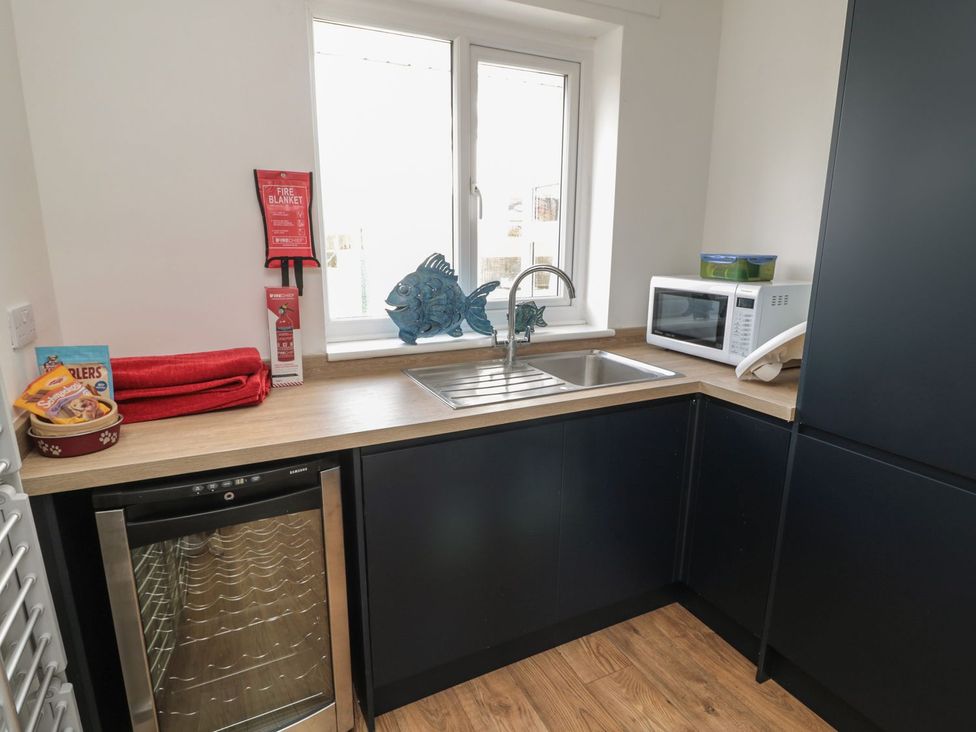 A kitchen with sink and appliances at 7 Longstone Close, Chathill