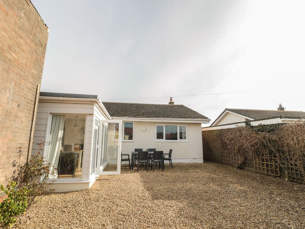 A garden area with table and chairs at 7 Longstone Close Chathill
