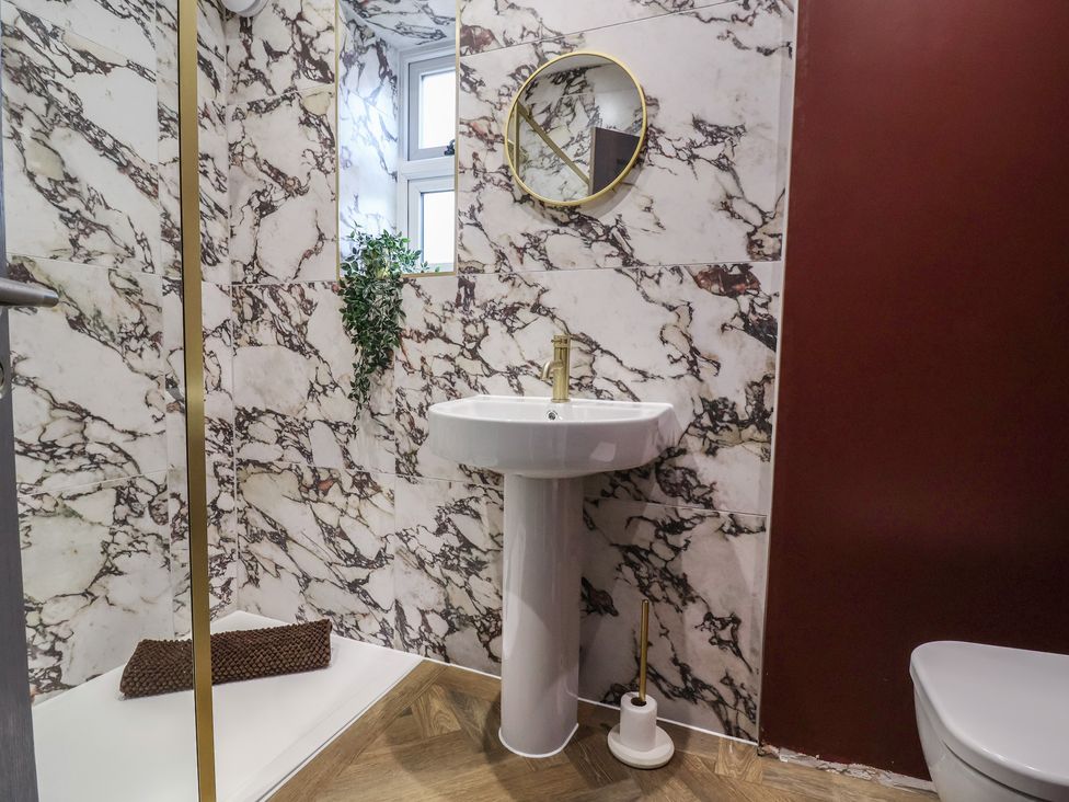 A bathroom with a sink and toilet at Bella Vista in Deganwy