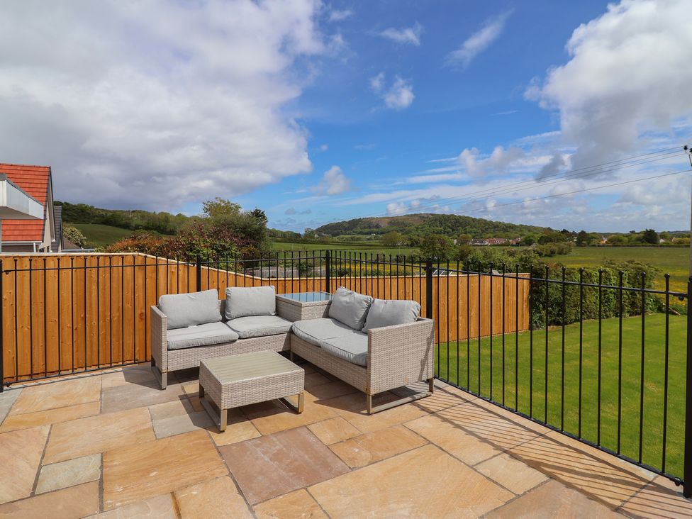 A patio with outdoor furniture at Bella Vista in Deganwy