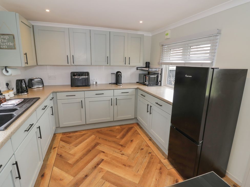 A kitchen with cabinets and appliances at 3 Swedish House Walgrave