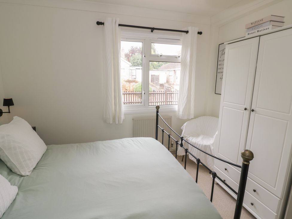 A bedroom with a bed and wardrobe at 3 Swedish House in Walgrave
