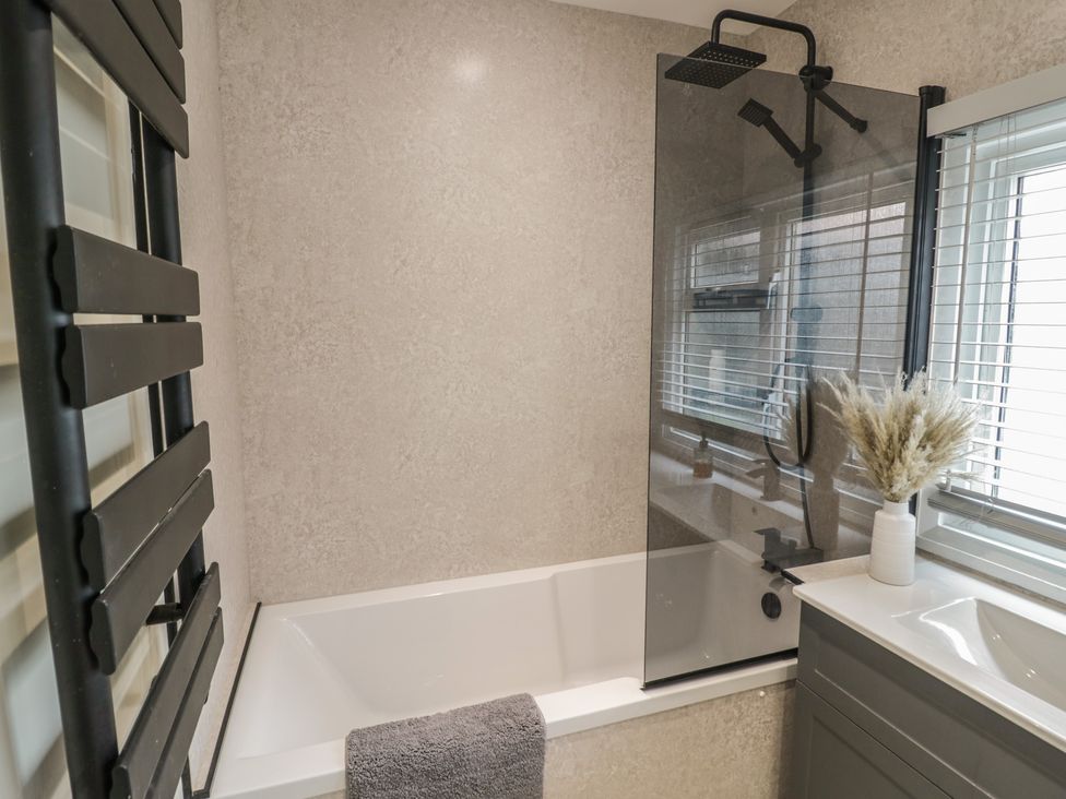 A bathroom featuring a bathtub, shower, and sink at 3 Swedish House Walgrave