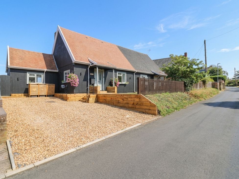 A house with a gravel driveway and steps at 3 Swedish House in Walgrave