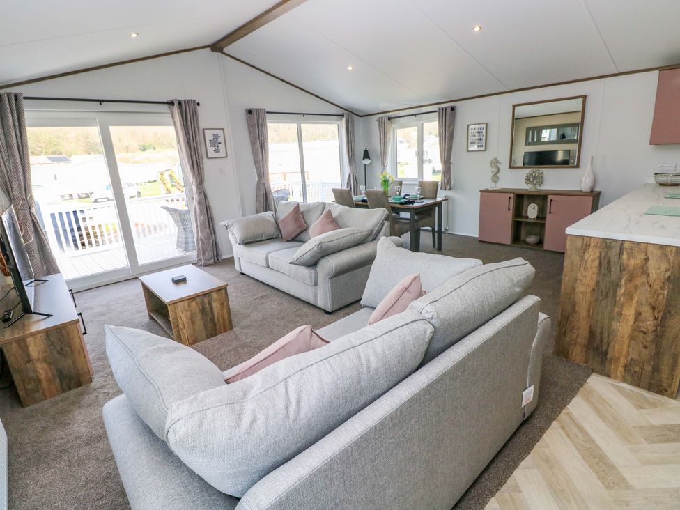 A living room with sofas and a coffee table at Dukes Meadow in Carmarthen