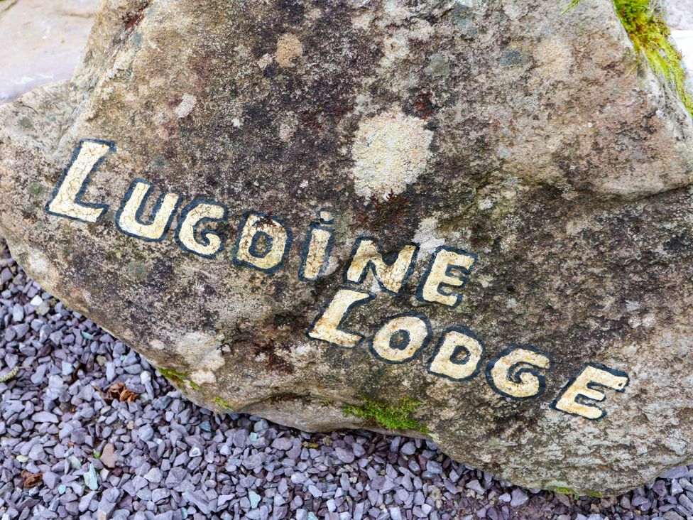 A rock with the name Lugdine Lodge at Lugdine Lodge Glengarriff