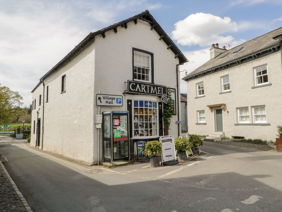 A building with a shop and signs at Burnside Cottage in Grange-Over-Sands