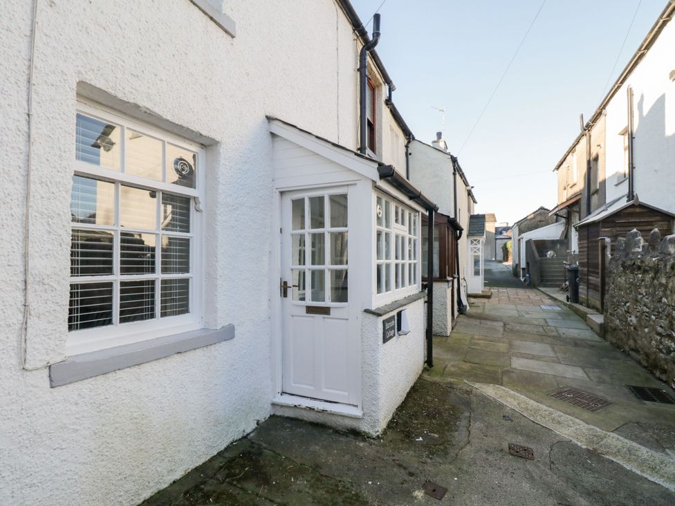 An exterior view of a cottage with a pathway at Burnside Cottage in Grange-Over-Sands