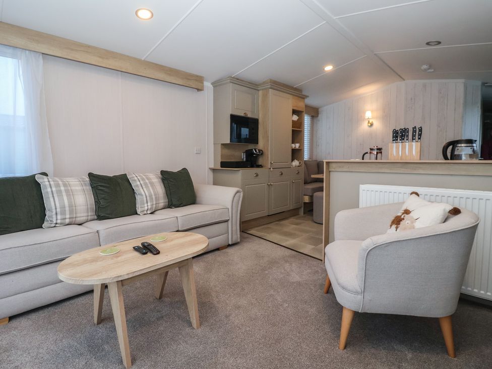 A living room with a sofa and coffee table at Lodge 22, Moselle in Malton