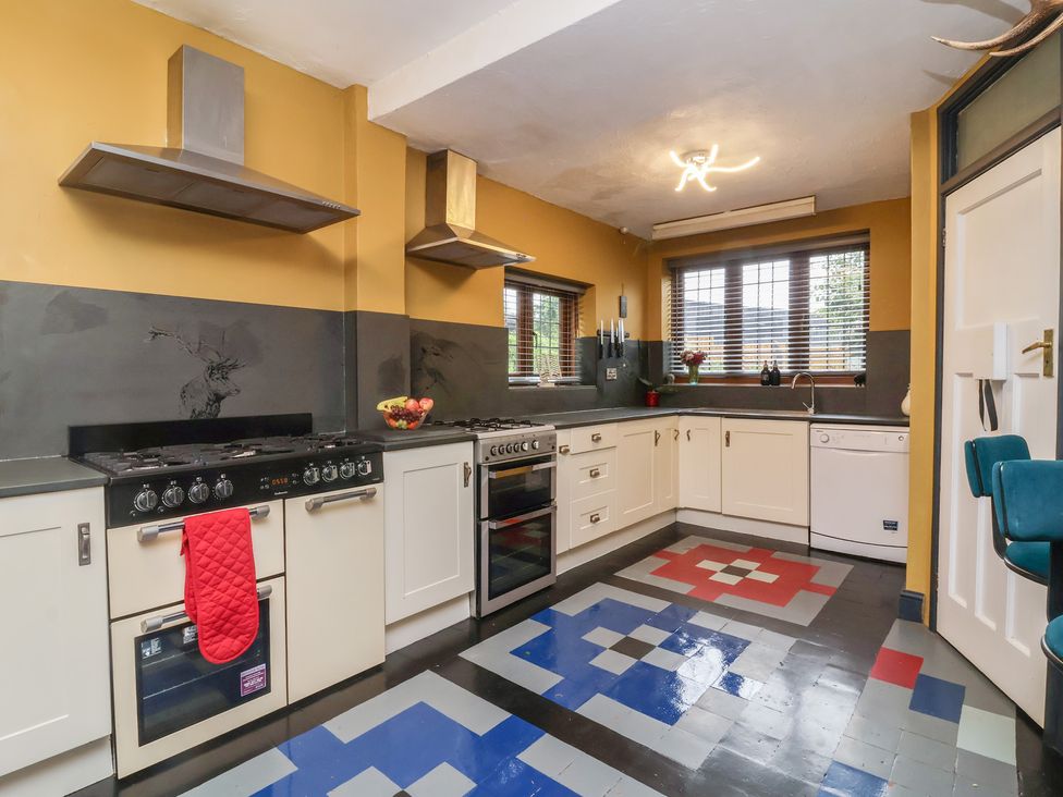 A kitchen equipped with appliances and countertops at West Down Country House in South Molton