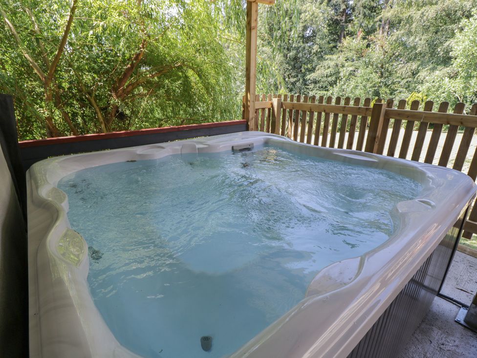 A hot tub in an outdoor area at West Down Country House South Molton