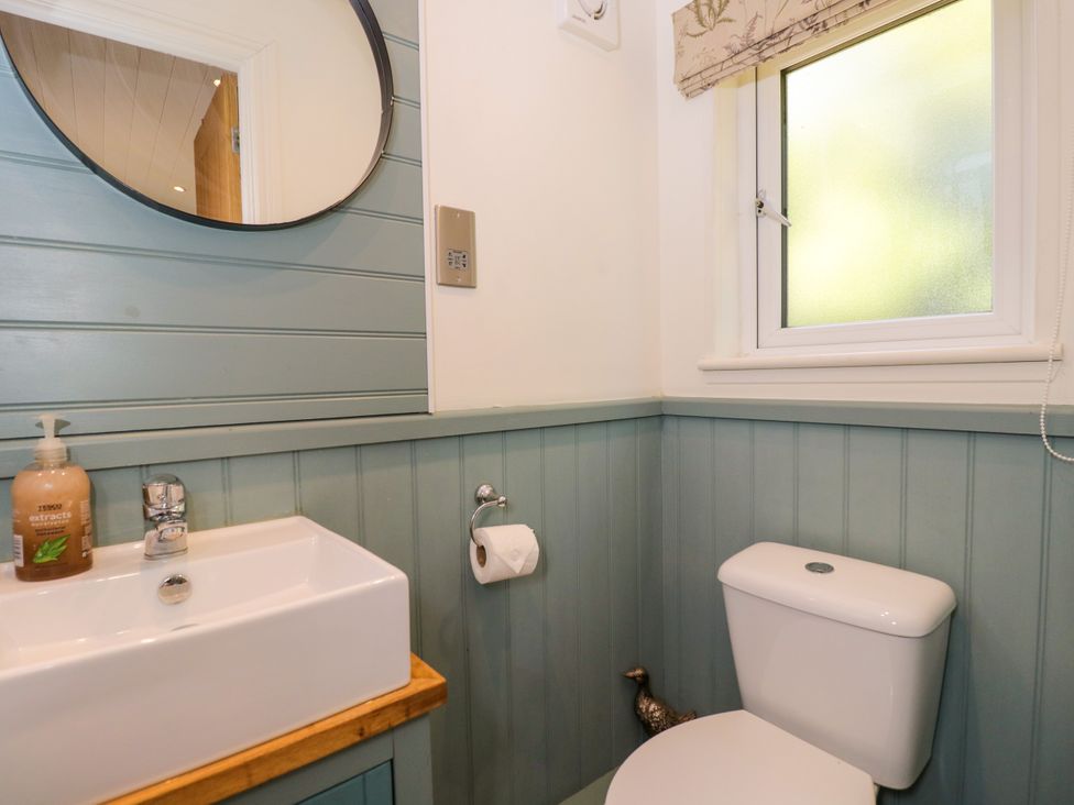 A bathroom with sink and toilet at Daisy Shepherd's Hut South Molton