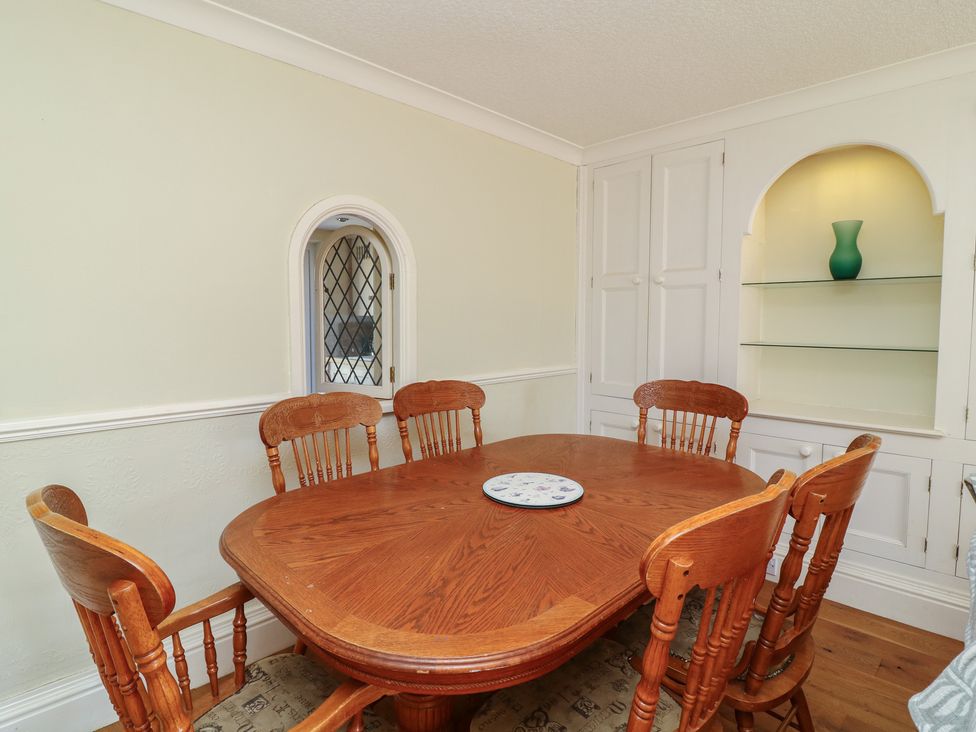 A dining room with a table and chairs at Highfields 
