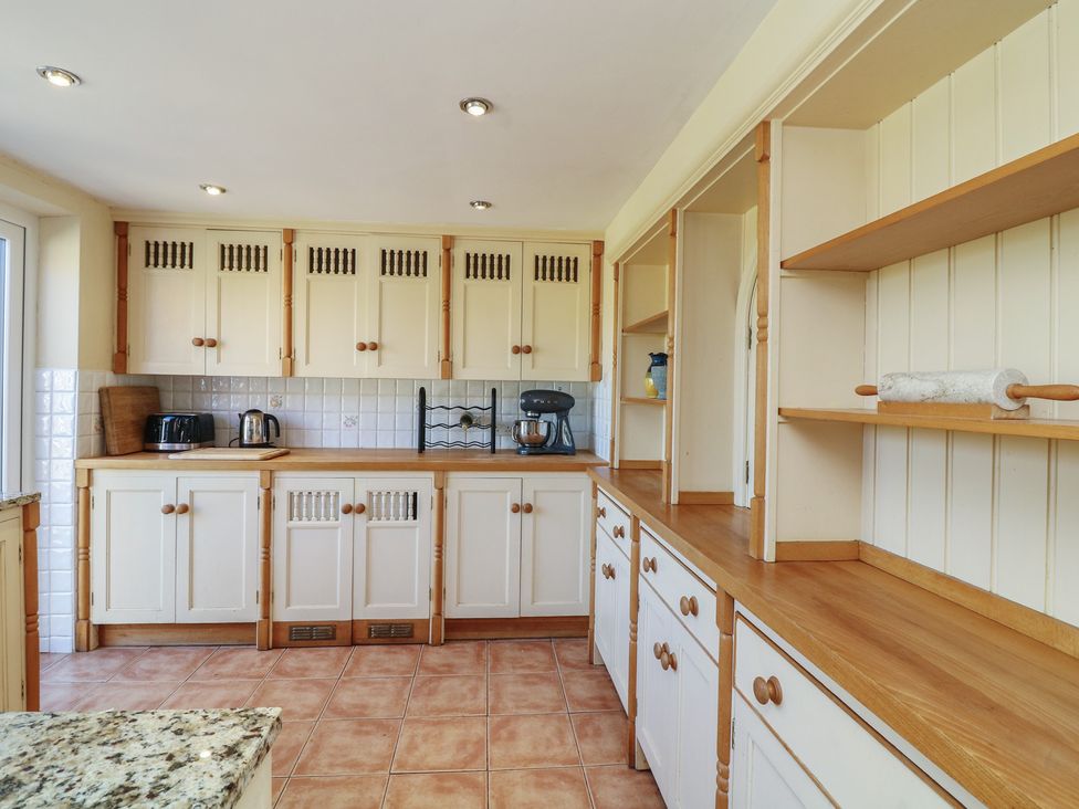 A kitchen with cabinets and appliances at Highfields