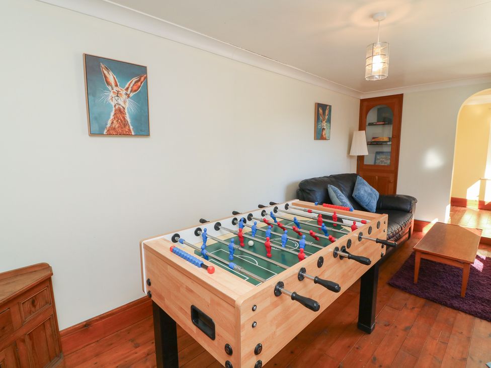 A game room with a foosball table and a sofa at Highfields