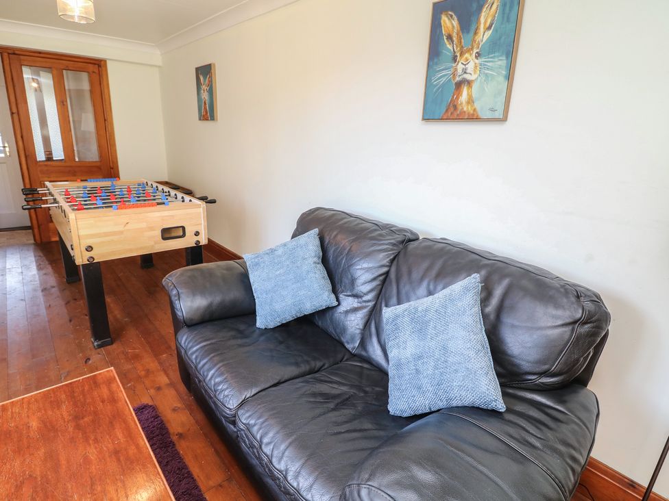 A snug with a foosball table and sofa at Highfields