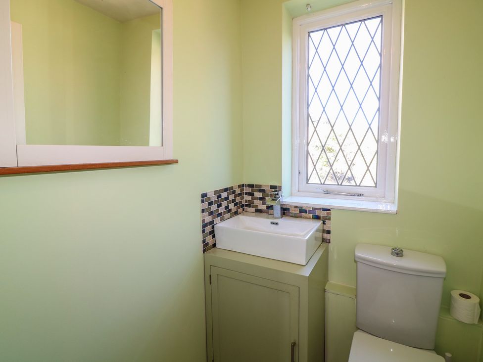 A bathroom with a sink and toilet at Highfields