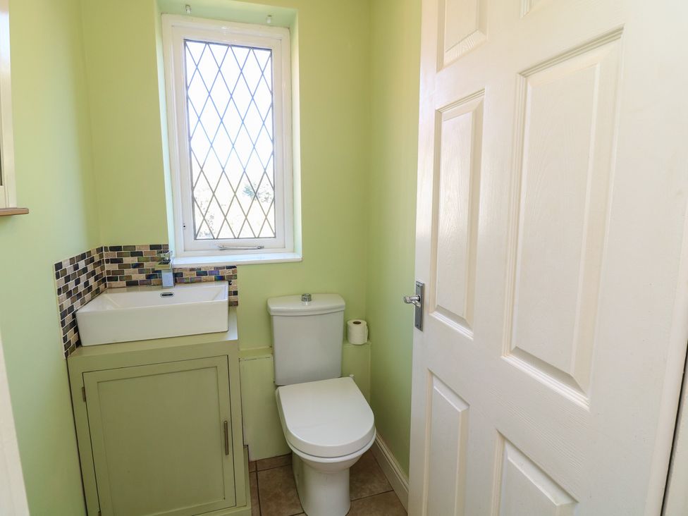A bathroom with a sink and toilet at Highfields