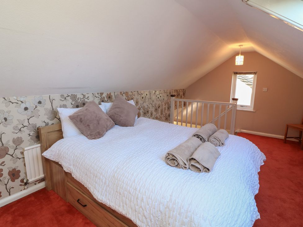 A bedroom with a bed and window at Highfields