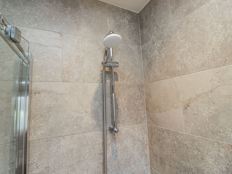 A shower with tile walls at Ambwray in Ambleside
