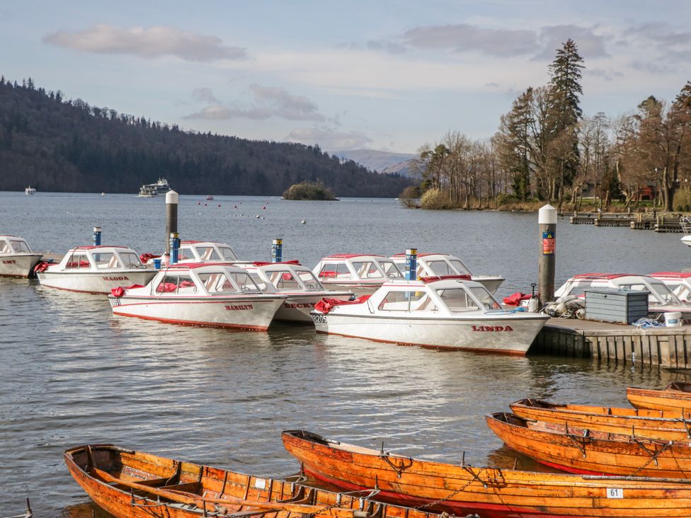 Boats docked at the water at Ambwray in Ambleside