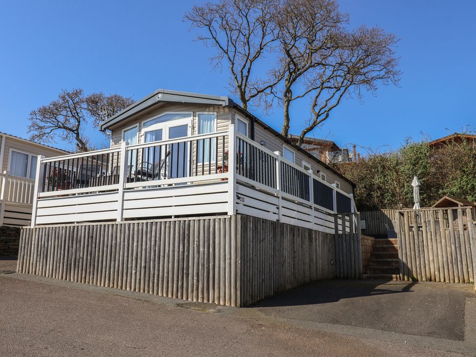 A mobile home with decking and steps at Bordeaux in Ladram Bay Otterton