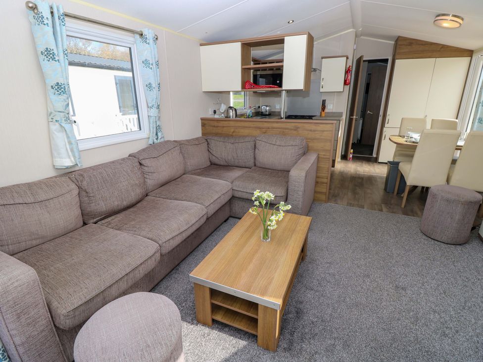 A living room with a sofa and coffee table at 63 Crosswinds in Bembridge