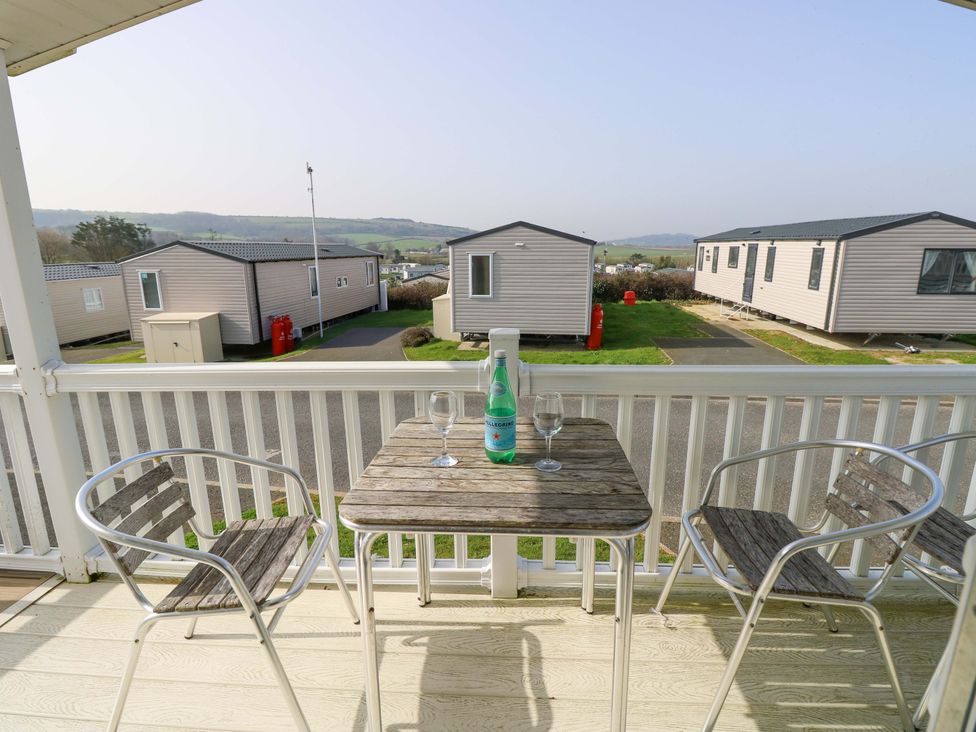 A balcony with a table and chairs at 63 Crosswinds in Bembridge